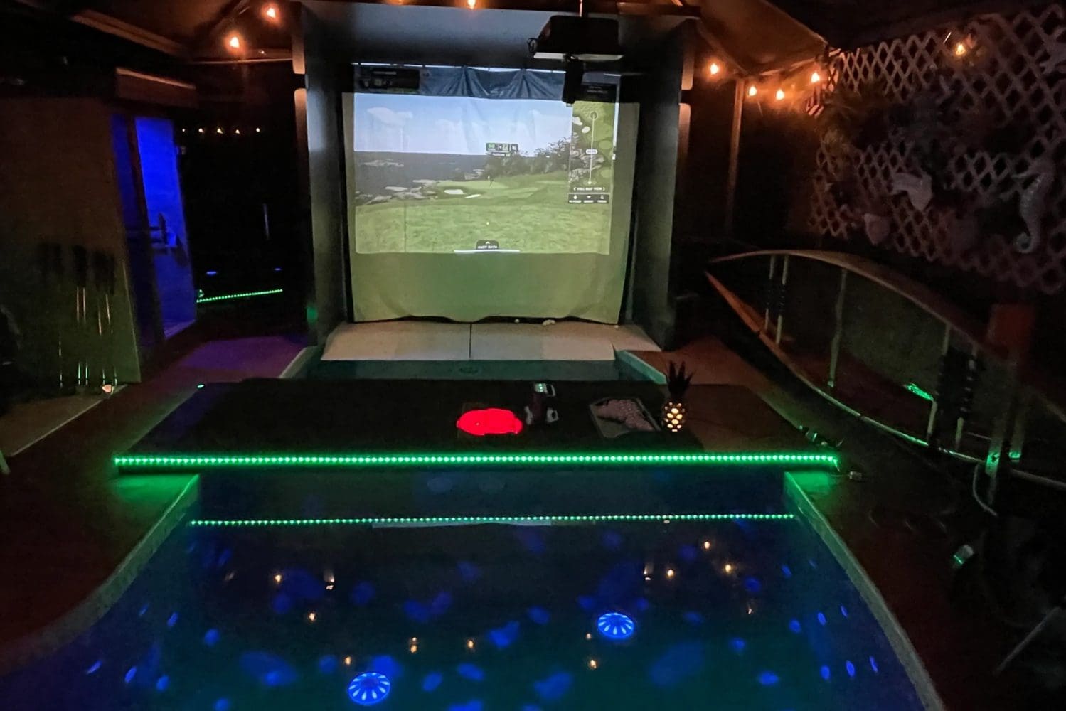 Indoor mini-golf setup with pool lighting.